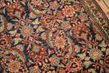 Angled view of the oversized Herati motif with clear drawing on a vintage Tabriz Sennehbaft rug.