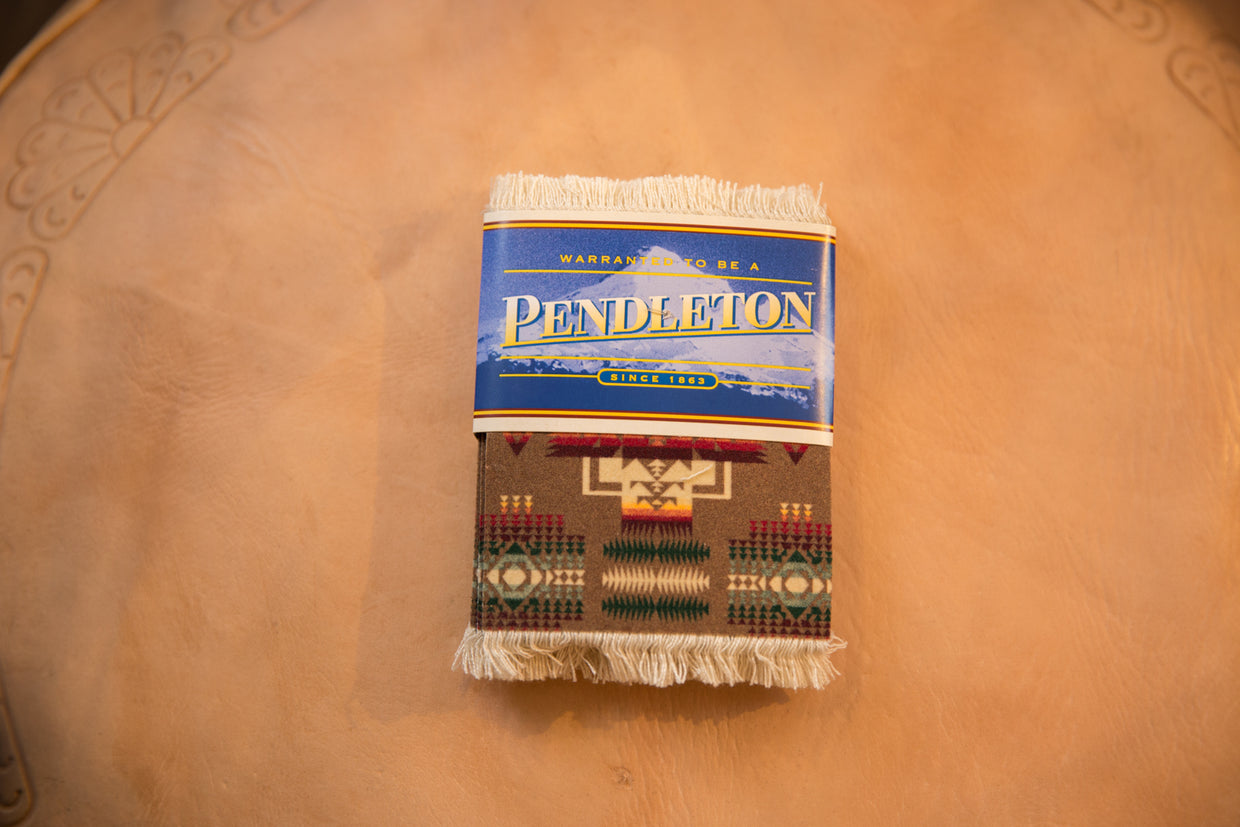 Pendleton Chief Joseph CoasterRug, vibrant Southwestern geometric pattern, blue label, and fringe.