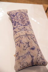 Soft woven texture and faded indigo patterns on the vintage Turkish rug pillow.