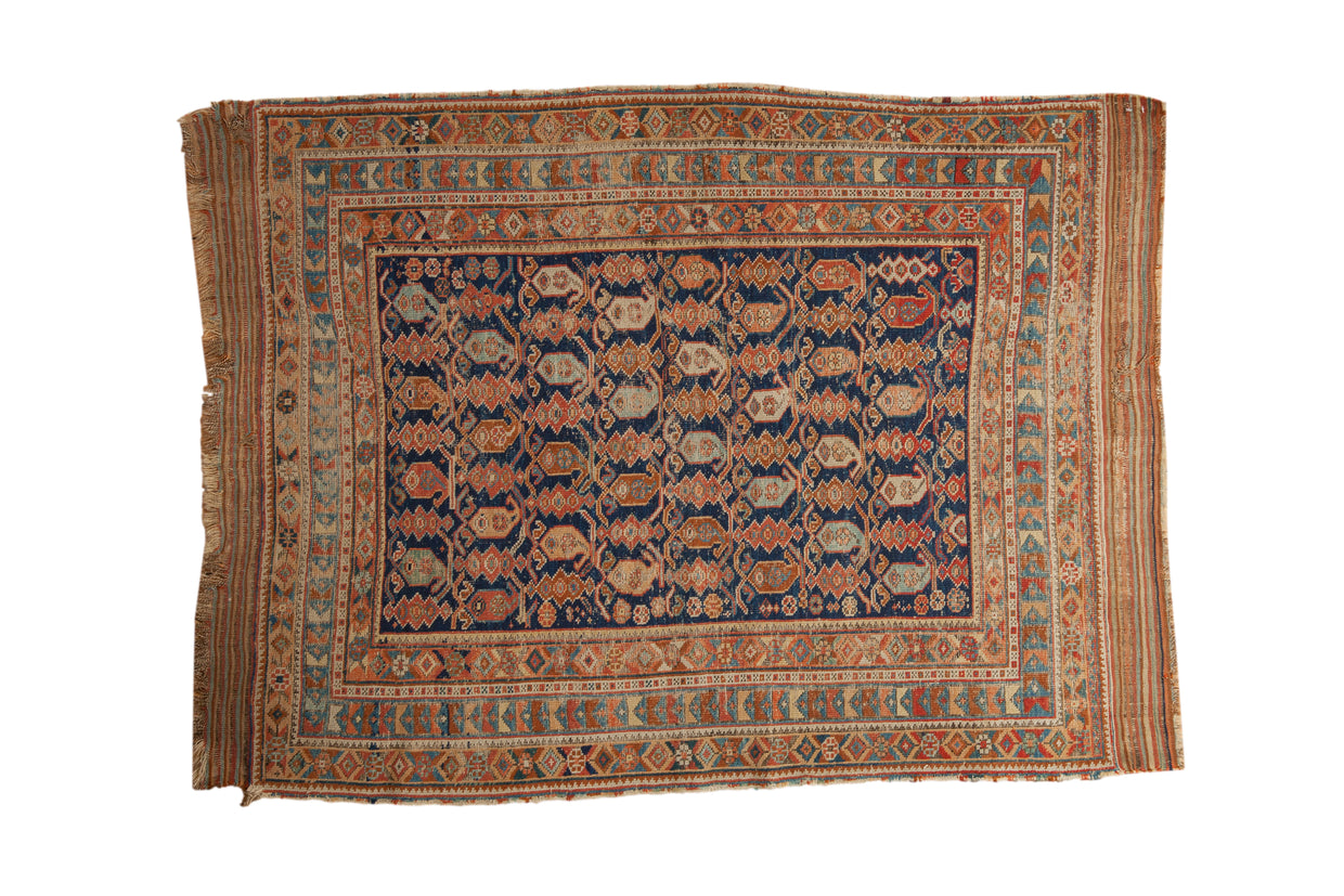 Antique Afshar rug with an allover boteh lattice design on a navy blue field.