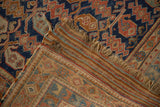The original striped kilim end and hand-knotted foundation of an antique Afshar rug.