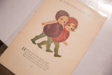 Angled view of the M.T. Ross illustration of two children as plums from an antique book page.