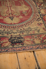 Detailed view of the maker's signature cartouche on an antique Persian Kerman runner.