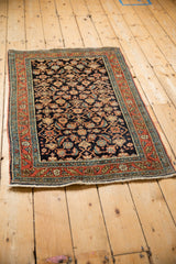 A perspective view of the fine antique Serapi rug, showing its intricate Herati motif.