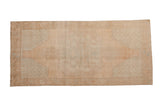 Distressed vintage Oushak runner, faded central medallion and corner spandrels, in pale sand and ocean green.
