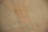 Distressed Oushak runner pile texture with even wear, featuring pale sand and ocean green.