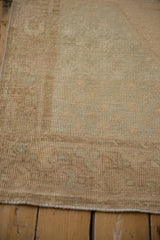 Textured, evenly worn pile of a vintage distressed Oushak runner, pale sand and platinum.