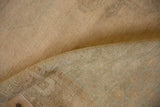 Tightly woven pale sand reverse foundation of the vintage Oushak runner.
