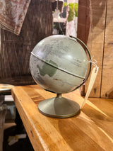 Vintage 1970s Replogle Moon globe piggy bank, 6-inch, with grey-green cratered surface.