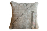 Distressed Turkish Oushak rug fragment pillow with faded gray, purple-pink, and mint patterns. 12x12.