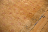 Mostly even wear on the distressed pale gold pile of a vintage Turkish Oushak runner.
