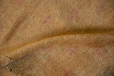 Textured hand-woven foundation on the reverse of a vintage distressed Oushak rug runner.
