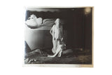 Black and white vintage movie still photograph: Salvador Dali's surreal draped figure scene.