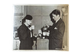 Black and white photograph of Ingrid Bergman and Gregory Peck sharing coffee.
