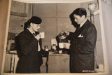 Candid black and white photograph showing Gregory Peck pouring coffee for Ingrid Bergman.