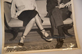 Ingrid Bergman's strappy shoes and John Emery's seated legs in the vintage Spellbound photograph.