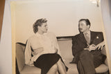 Ingrid Bergman and John Emery conversing in a black and white vintage Spellbound photograph.