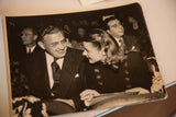 An angled view of the vintage photograph showing Ingrid Bergman smiling at David Selznick.