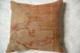 Worn beige, orange, and peach patterns on a vintage Turkish pillow fragment.