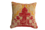 Antique hand-knotted rug fragment pillow, 18x18, with red and golden abstract geometric pattern.