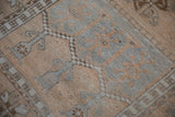 Evenly worn hand-knotted pile of a vintage Oushak in silver and pale saffron.