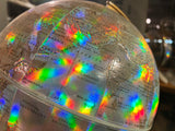 Prism holographic effect with rainbow colors on the vintage world globe.