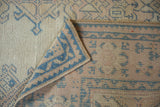 The hand-knotted foundation and secure side cord of the vintage distressed Oushak carpet.
