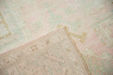 The hand-knotted back and original side cord of a distressed Turkish Oushak carpet.