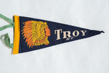 Dark blue felt pennant showcasing the vibrant orange and yellow Native American headdress graphic.