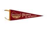 Vintage Howe Caverns felt flag in red with a gold graphic of The Lodge and cream lettering.