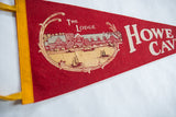Detailed graphic of The Lodge screen-printed on the red felt of a vintage pennant.