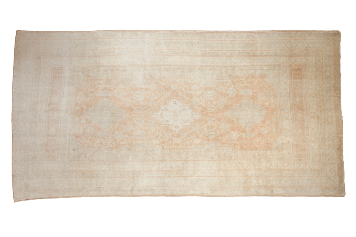 Vintage distressed Oushak carpet with a triple medallion in soft tone-on-tone tangerine and ivory.