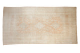 Vintage distressed Oushak carpet with a triple medallion in soft tone-on-tone tangerine and ivory.
