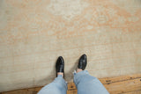 Soft wool texture and low, even pile on a vintage distressed Turkish Oushak carpet.