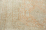 Even, short wool pile of a vintage Oushak with soft, tone-on-tone coloring.
