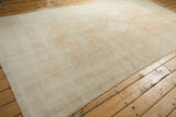 Angled perspective showing the full length and lustrous even pile of a vintage Oushak carpet.