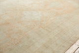 Lustrous, short wool pile of a vintage Oushak carpet with areas of soft tangerine tinting.