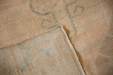 Reverse of a vintage Oushak showing the hand-knotted foundation and side cord.