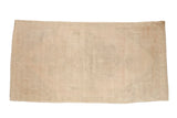 Distressed Oushak rug runner with a faint tone-on-tone medallion in pale dusty rose and sand.