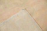 Hand-knotted foundation and secured side selvage of a distressed Turkish Oushak rug.