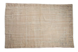 Vintage distressed Oushak carpet with a subtle central medallion and faded beige tones, 5'2