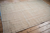 Distressed Oushak carpet pile showing worn knots, foundation, and muted beige abrashes.