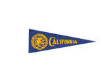Vintage University of California felt flag, royal blue with yellow school crest and 'California' text.