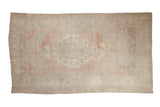 Distressed vintage Oushak carpet, pale pink, sea foam green medallion, plant border, 6'2