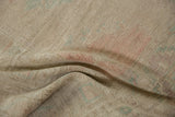 Hand-knotted foundation texture on the reverse of the distressed Oushak rug.