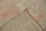 Distressed Oushak carpet foundation and intact selvage, with faded pink and sea foam pile.