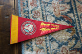 Vintage red felt New York Thruway flag with yellow border, state cutout graphic, 4x9 inches.