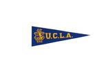 Royal blue vintage UCLA felt pennant with yellow school crest, 3.25x9.75 inches.