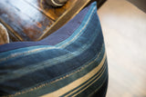Indigo African Throw Pillow, varying blue and cream stripes with visible hand stitching.