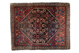Fine Persian Farahan Sarouk square rug with a detailed navy Herati medallion on a cranberry red field.